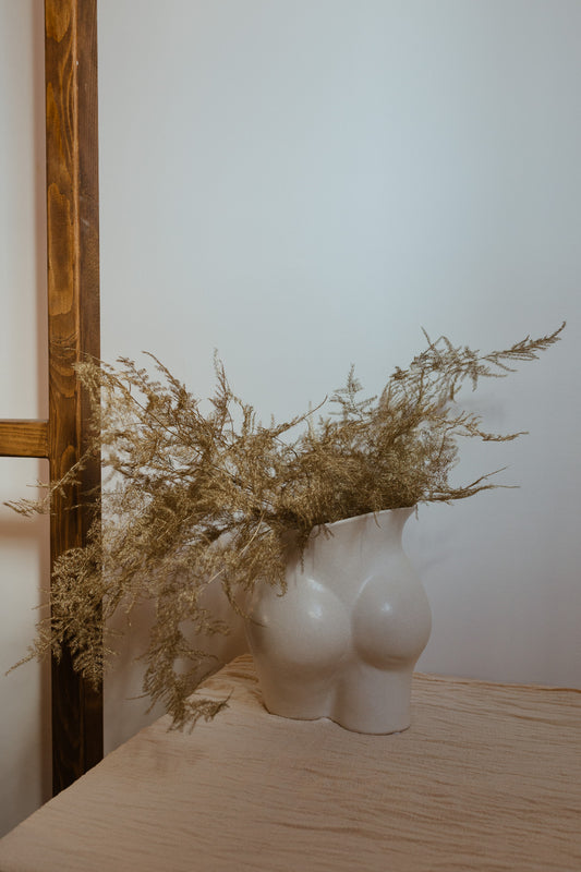 FLORAL DECORATION IN BOOTY VASE