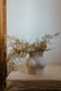 FLORAL DECORATION IN BOOTY VASE